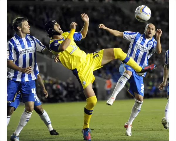Brighton v Sheffield Wednesday... Owls Miguel Llera battles it out with Albion pair of Bruno & Hammond