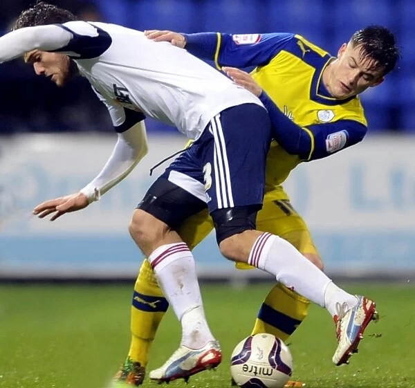 Bolton Wanderers v Sheffield Wednesday... Owls Rhys McCabe tackles Boltons Marcos Alonso