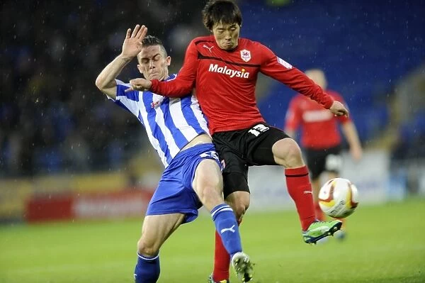 Cardiff City v Sheffield Wednesday... Owls David Prutton stops Citys Kim Bo-Kyung