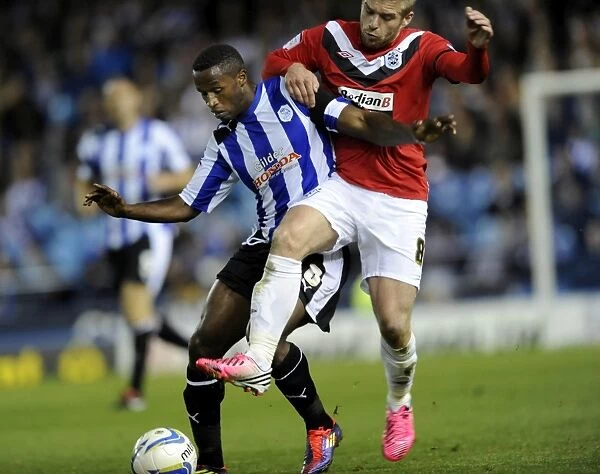 Sheffield Wednesday v Huddersfield... Jose semedo holds off Adam Clayton
