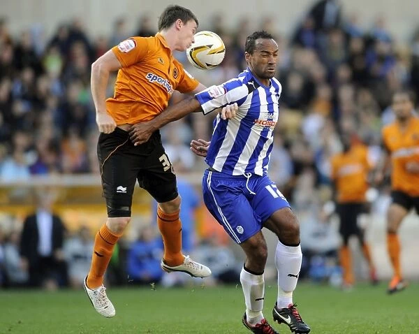 Wolverhampton Wanderers v Sheffield Wednesday... Owls Chris O Grady with Wolves Kevin Foley