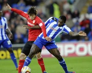 Cardiff City v Sheffield Wednesday... Owls Michail Antonio holds off Citys Kim Bo-Kyung