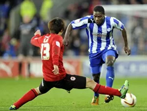 Images Dated 2nd December 2012: Cardiff City v Sheffield Wednesday... Owls Jeremy Helan takes on Citys Kim Bo-Kyung