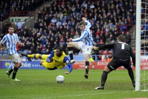 Huddersfield Town v Sheffield Wednesday... Owls Reda Johnson nearly heads home a