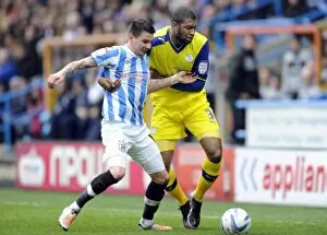 Images Dated 29th December 2012: Huddersfield Town v Sheffield Wednesday... Owls Reda Johnson with Towns Adam Hammill