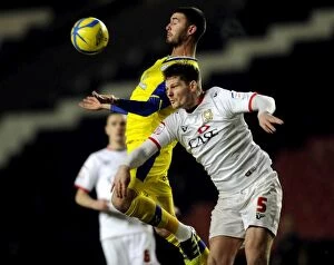 Images Dated 15th January 2013: MK Dons v Owls... Gary Madine holkds off Dons MacKenzie