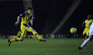 MK Dons v Owls Lewis Buxton fires in a shot