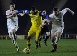 MK Dons v OwlsGary Madine blocked by Dons pair of Williams and Mackenzie