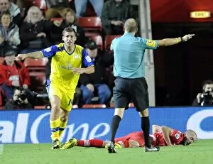 Images Dated 25th September 2012: Penalty Owls Joe Mattock claims his tackle on Saints Steve De Ridder is outside the box referee
