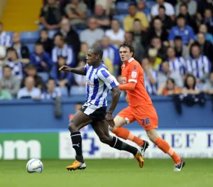 Sheffield Wednesday v Millwall... Michail Antonio gets away from Scott Malone