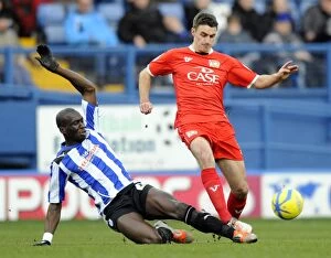 Images Dated 5th January 2013: Sheffield Wednesday v MK Dons... Ex Owl Darren Potter stoped by Mamady Sidibe