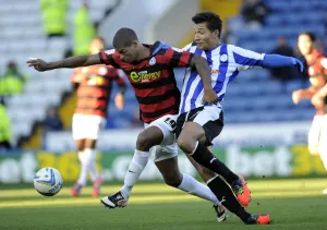 Sheffield Wednesday v Peterborough Utd... Posh Mark Little holds off Owls Jay Bothroyd