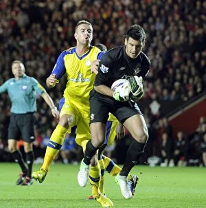 Images Dated 25th September 2012: Southampton v Sheffield Wednesday... Mark Beevers on Saints keeper Paulo Gazzaniga
