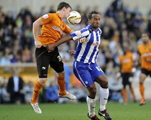 Wolves vs SWFC September 29th 2012 Collection: Wolverhampton Wanderers v Sheffield Wednesday... Owls Chris O Grady with Wolves Kevin Foley